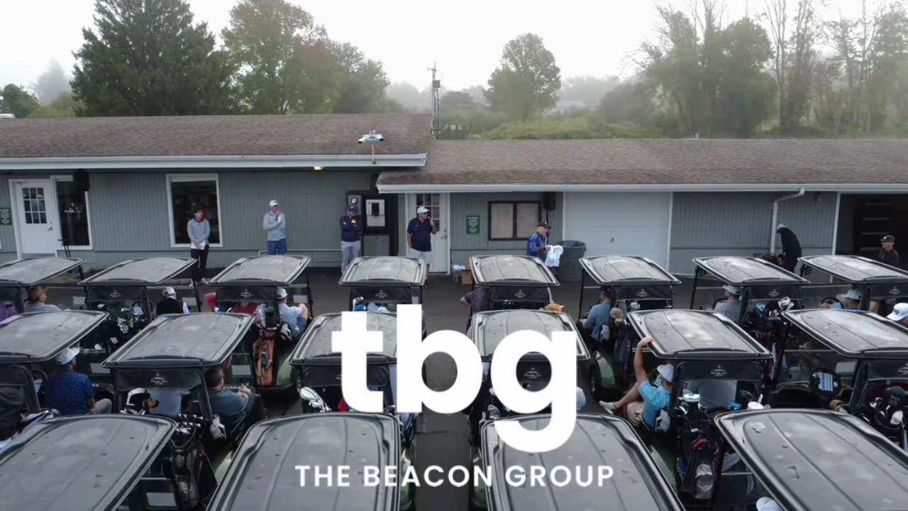 Golf carts lined up at the start of the TBG Beach Classic
