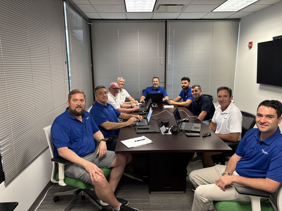 The Beacon Group team in a conference room